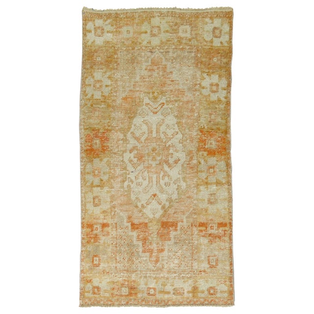Shabby chic Turkish rug with pops of orange. 2'8'' x 4'9''