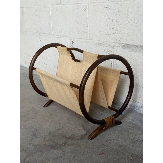Circular bent bamboo frames support a double-pocket sling for dual storage. This open-air accent offers warm textural...