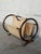 Circular bent bamboo frames support a double-pocket sling for dual storage. This open-air accent offers warm textural...