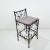 Unique wrought iron vanity stool in the style of Les Atelier Courbet. Heavy and sturdy with iron slats supporting leather...