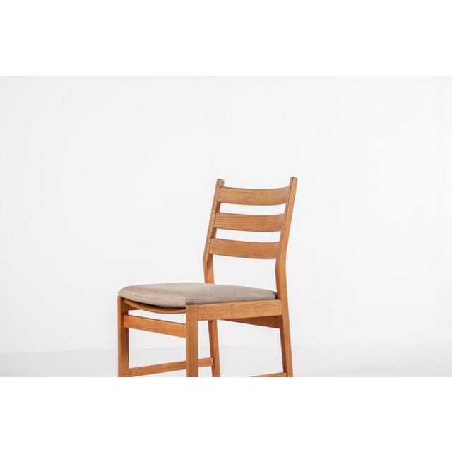 This beautiful set of four dining chairs was designed by Kurt Østervig and made in Denmark. The frames are crafted from...
