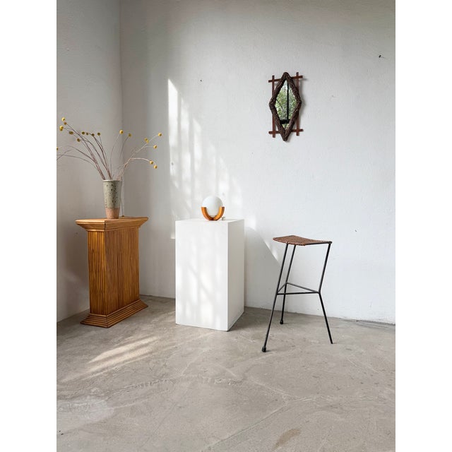 Vintage metal stool with a rattan and woven wicker seat, dating from the 1950s, designed by Dennis Lennon. We love the...