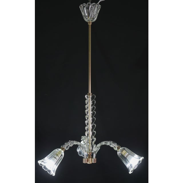 Exquisite three-armed light chandelier. Period: circa 1940 Height 95 centimeters, diameter 60 centimeters. Excellent...
