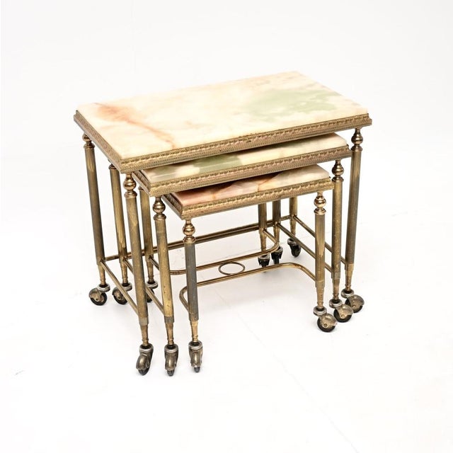 A beautiful antique French brass and onyx nest of tables, dating from around the 1930’s. They are of superb quality, the...