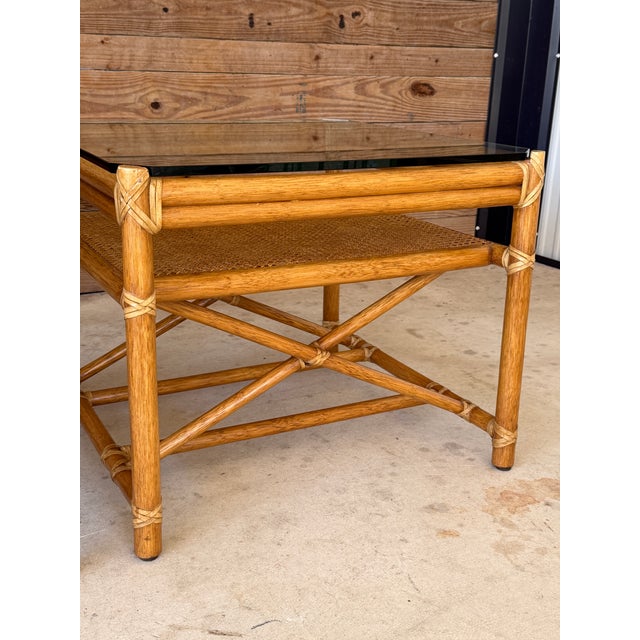 1980s Pair of Vintage McGuire Organic Modern Rattan Side Tables With Cane Shelves and Glass Tops For Sale - Image 5 of 12