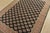 A tribal Bokhara Jaldar rug hand-knotted with fine wool on a cotton foundation. This rug features rows of repeating...