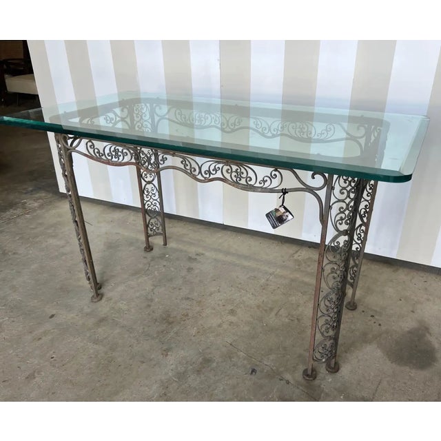 Great little beveled glass topped iron table. Could be used in a garden, as a breakfast table, console, or as a center...