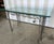 Great little beveled glass topped iron table. Could be used in a garden, as a breakfast table, console, or as a center...