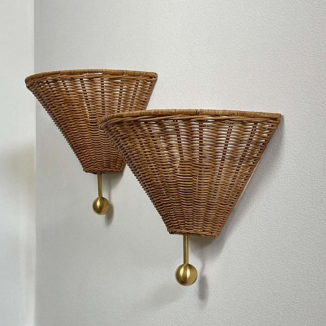 These Mid-Century wall lights were designed and manufactured in Austria in the 1950s to 1960s. The sconces feature a pair...