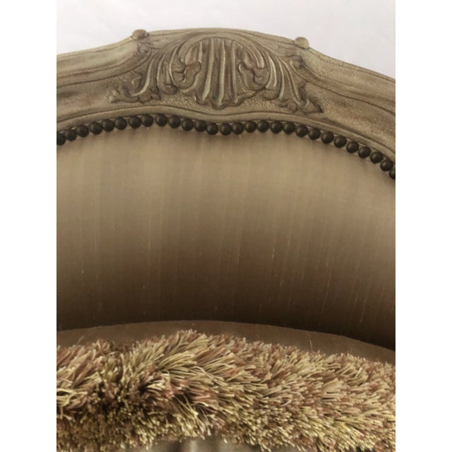 Exquisite Caracole Compositions taupe silk oversized French chair with a crackle finish . Measures 36” w x 36” d x 43” h...