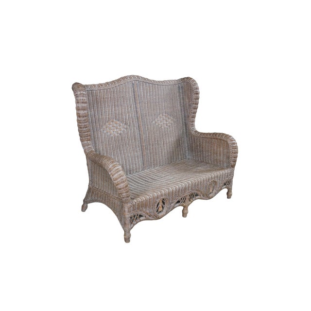 This striking antique-style Victorian Revival wicker high wingback settee bench features an intricate, tight-weave...