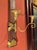 A rare pair of antique Tuscan Empire giltwood and faux porphyry wall sconces from a historic Italian villa, masterfully...