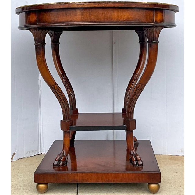 This is a pair of striking mid-century bench-made side tables. They have a beautiful finish with unique carved legs. I...