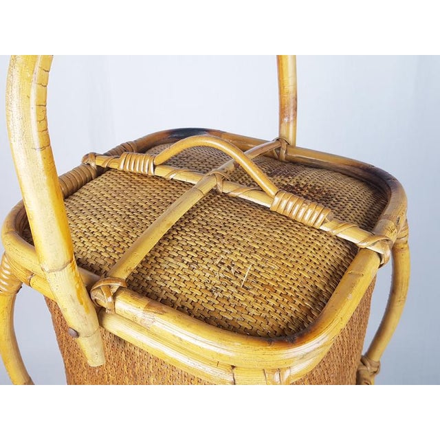 Decorative work basket made of rush and Vienna straw has an elegant and slender shape and a refined workmanship. It can...