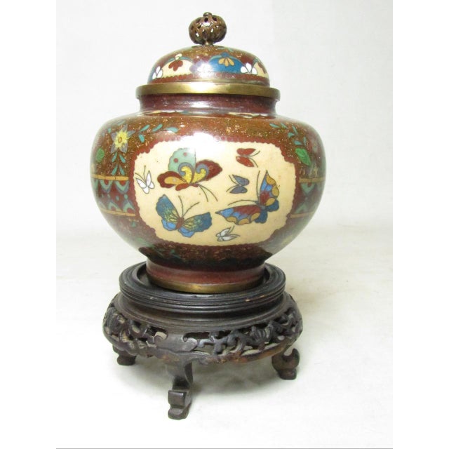 Japanese cloisonné urn on stand, c.1030’s A good example of a fine quality cloisonné urn with lid. Decorated on all sides...