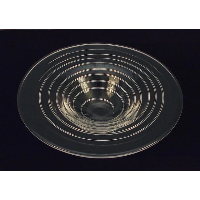 Offering a hand-blown, beautifully designed and crafted crystal-clear art glass bowl of "indeterminate origins." I'm sure...