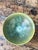 This vintage studio pottery green bowl is a compelling example of mid-20th-century artisan ceramic work, where expressive...