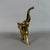 A majestic, handcrafted solid brass elephant with a raised trunk, a symbol of good luck and prosperity, dating back to the...