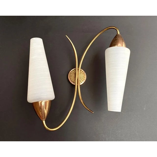 Beautiful french wall light with two diffusers made of matte art glass, brass and copper. the white glass diffusers help...