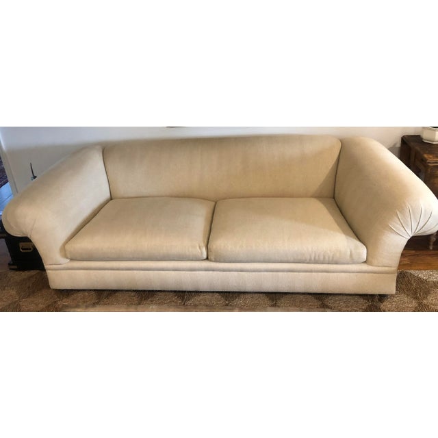 Beautiful sofa on legs with casters upholstered in Holland and Sherry neutral herringbone fabric. In excellent condition...