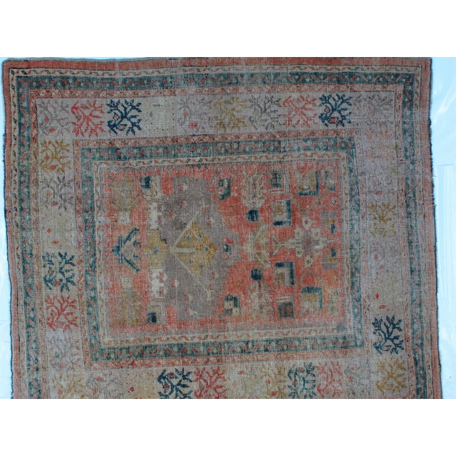 This masterpiece is a wool on wool pile genuine antique Oushak carpet. The piece was handwoven and has age related wear.