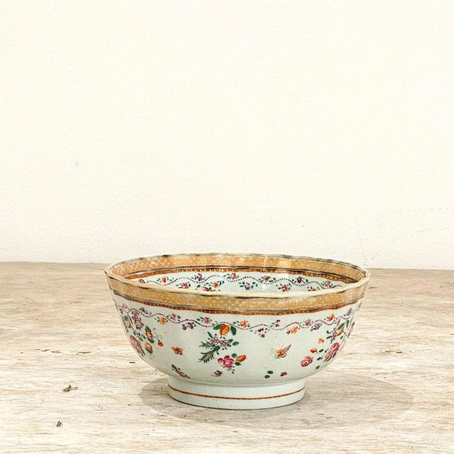 A late 18th Century Export porcelain bowl, China circa 1790. The bowl is decorated in pink and purple flowers on the...