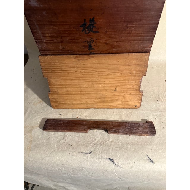 This is an antique Japanese carrying case that may have been used for tools. It can be used for other items and was built...