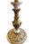 The base of this candlestick lamp is painted cream and gold. It is wired for modern use and includes a cream shade.