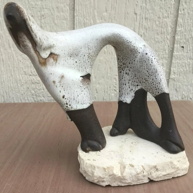 Mid century signed Dega art pottery Hound sculpture. Modernist sculpture set on a stone base. Signed Dega. We always...