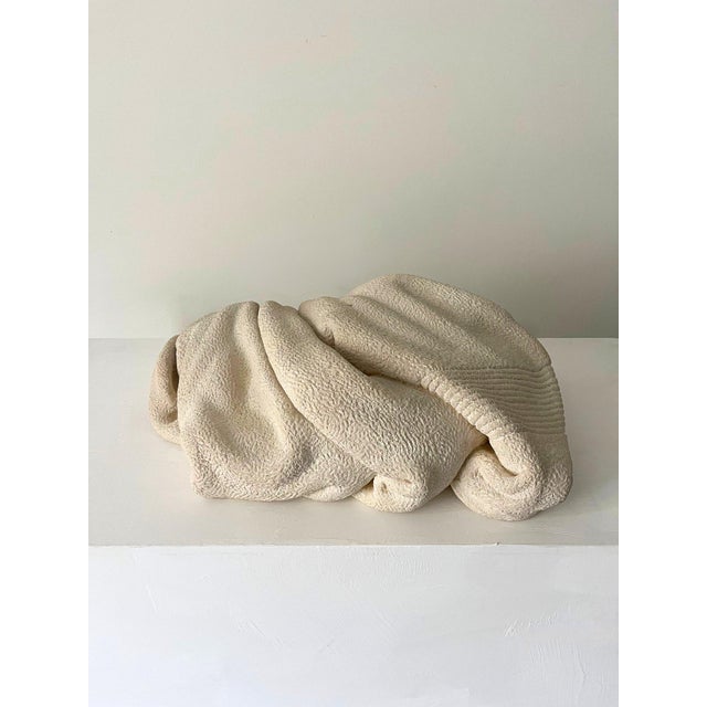 This eye catching sculpture is available by commission and depicts a discarded towel on the floor and has been carved and...