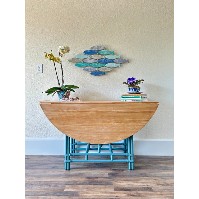 Beautifully restored Heywood-Wakefield drop leaf dining table dating to the 1950s–1960s. This vintage American dining...