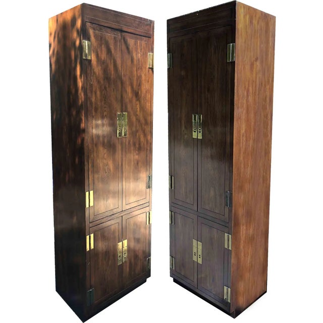 We love this gorgeous pair of vintage campaign style chifforobes or armoires by one of the most esteemed American...