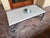 Kreiss Capri patio coffee table. Table has aluminum base with travertine top. Base has wear on finish. Top is in good...