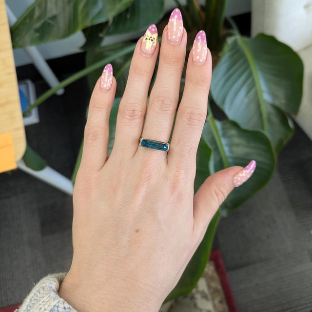 Elegant 6.5 ct blue zircon emerald-cut solitaire (16.4×4.5 mm) beautifully framed in solid 14K gold — classic sparkle...