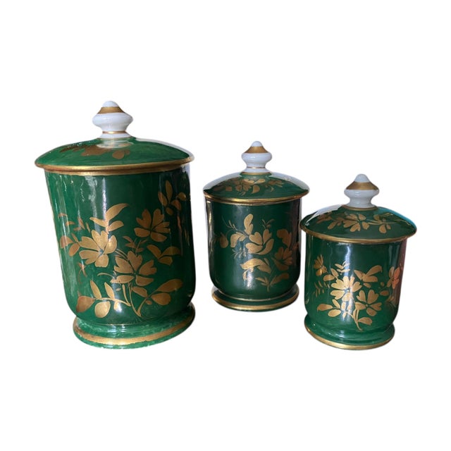 A set of 3 antique (late 19th century) hand painted and decorated green apothecary or toiletries jars (lids included) made...