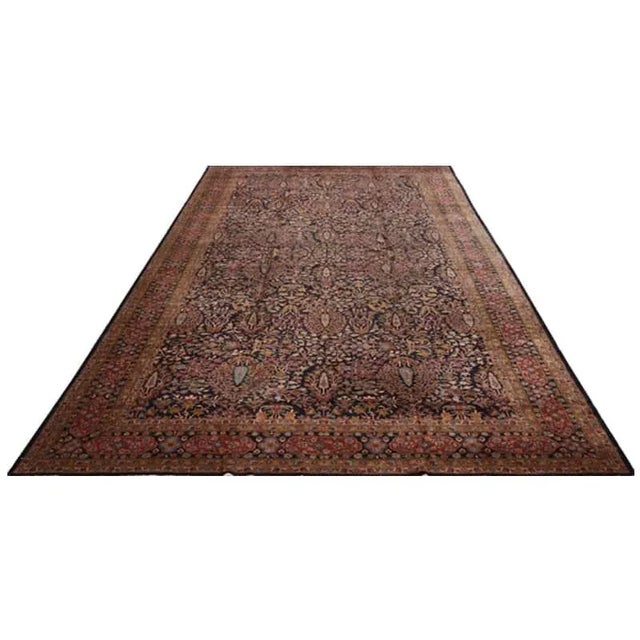 ACTUAL SIZE: 10’2″ x 20’5″ PRIMARY COLOR: Navy-Black / Gold AGE: Antique ORIGIN: India MATERIALS: Wool FOUNDATION: Cotton...