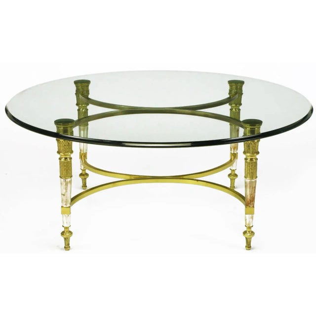 Solid brass and aged nickel empire style coffee table in the manner of Labarge, with segmented pillar legs and rounded...