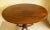 Beautiful 19th Century English Regency Mahogany Table. Table features an oval mahogany top enriched by a carved and banded...