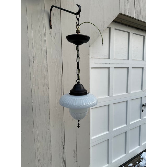 Old Lights On is pleased to offer this awesome deco shade with brass hanging fixture. It is rewired and ready to install....