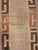 Hand-woven and embroidered/appliquéd fibers from the raffia palm (Raphia). Features a central chevron or zigzag panel...