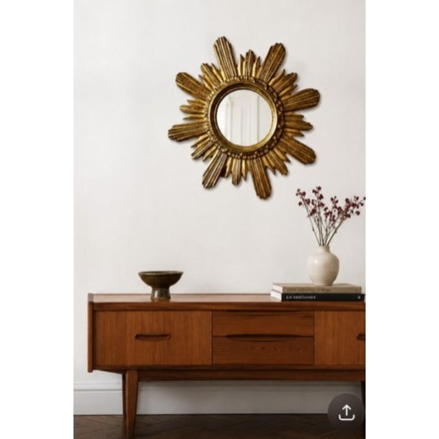A striking mid-century german sunburst mirror manufactured by wenz, circa 1960. Featuring a beautifully sculpted giltwood...