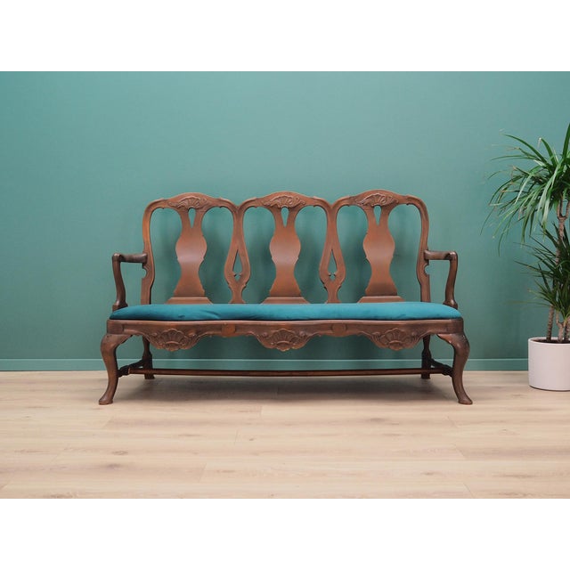 The Chippendale style living room set from the 1970s, Danish production. The structure was made of walnut wood. Wood after...