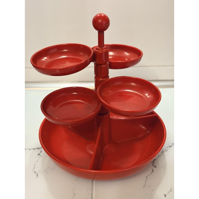 Eye-catching space age rotating snack server attributed to emsa, west germany, circa 1970s. Crafted in vibrant red abs...