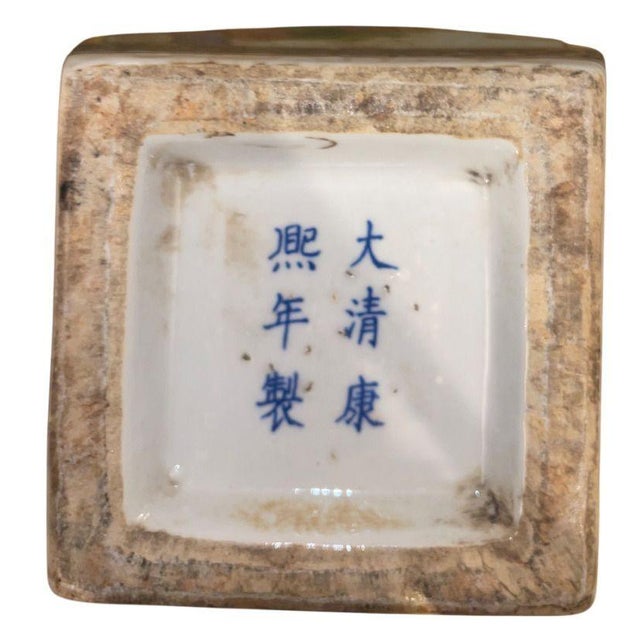 A finely decorated pair of Chinese porcelain vases, painted in the famille verte palette and bearing a blue underglaze...