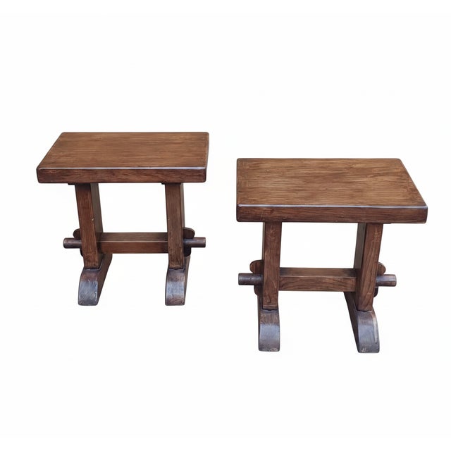 Pair of solid wood stools with crosspiece. Comfortable rectangular seat. Made in Italy.