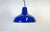Industrial blue enamel factory pendant light made in United Kingdom during the 1960s. White enamel inside the shade. Brass...