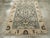 This mid-20th-century Persian Malayer accent rug presents a balanced geometric-floral composition across a muted blue...