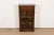 A gorgeous English Regency or Sheraton style hand painted bookcase featuring a trompe-l'œil painting of books on the door....