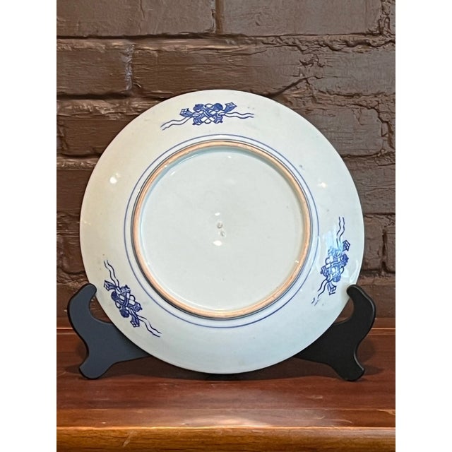 Offered is a stunning and substantial 12-inch antique Chinese blue and white porcelain charger, featuring a finely hand-...