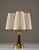 Swedish table lamp manufactured by asea in the 1940s. Made from brushed brass with a teak accent, it reflects the quality...